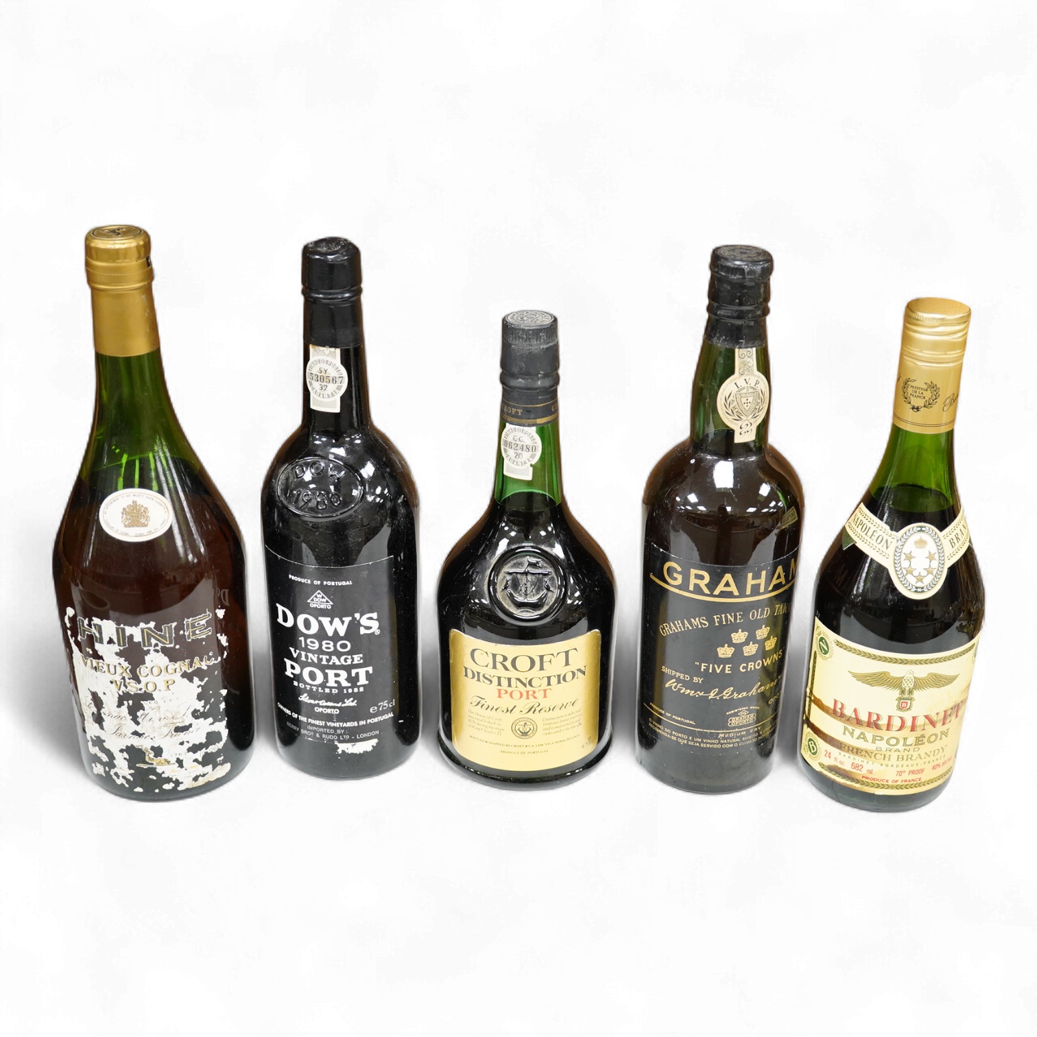 Five bottles of port and brandy, including a bottle of Dow’s 1980 bottle of port